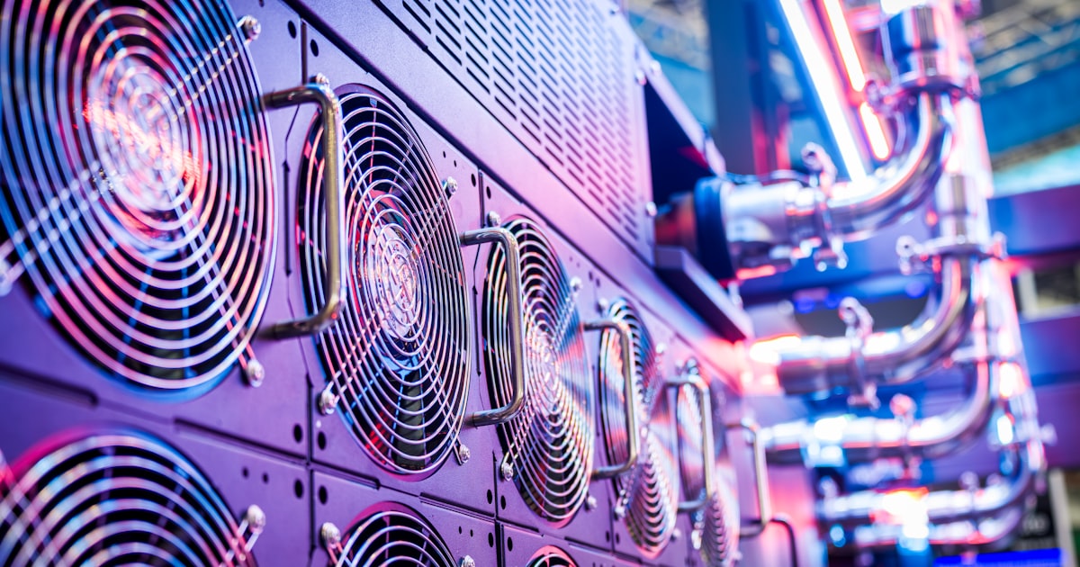 Close-up of server cooling fans in a vibrant data center.
