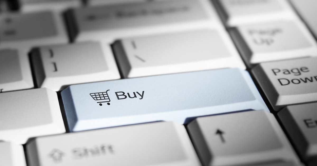 Close-up of a keyboard with a prominent 'buy' button.