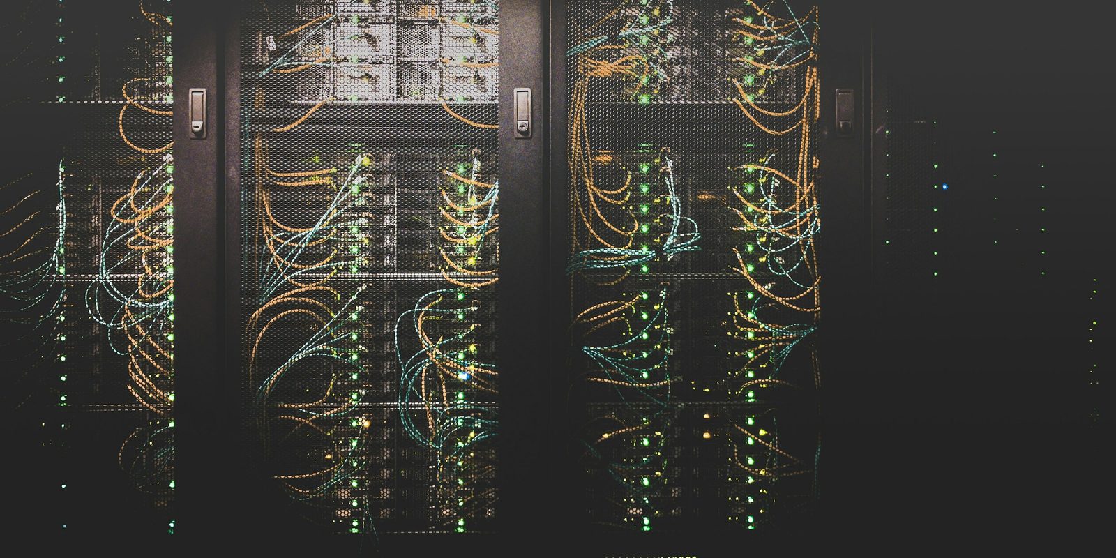 A patch panel densely packed with network cables running to switch ports.