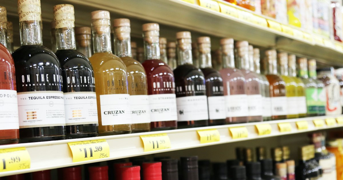 Bottles of liquor displayed on store shelves