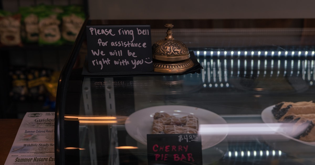 A bell and sign on a display case