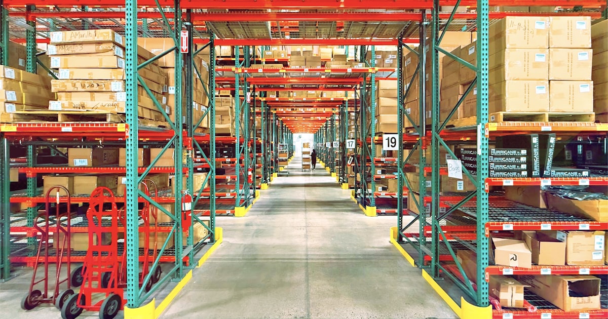 A warehouse is filled with shelves and boxes