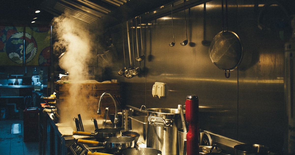 stainless steel cooking pots on a stove