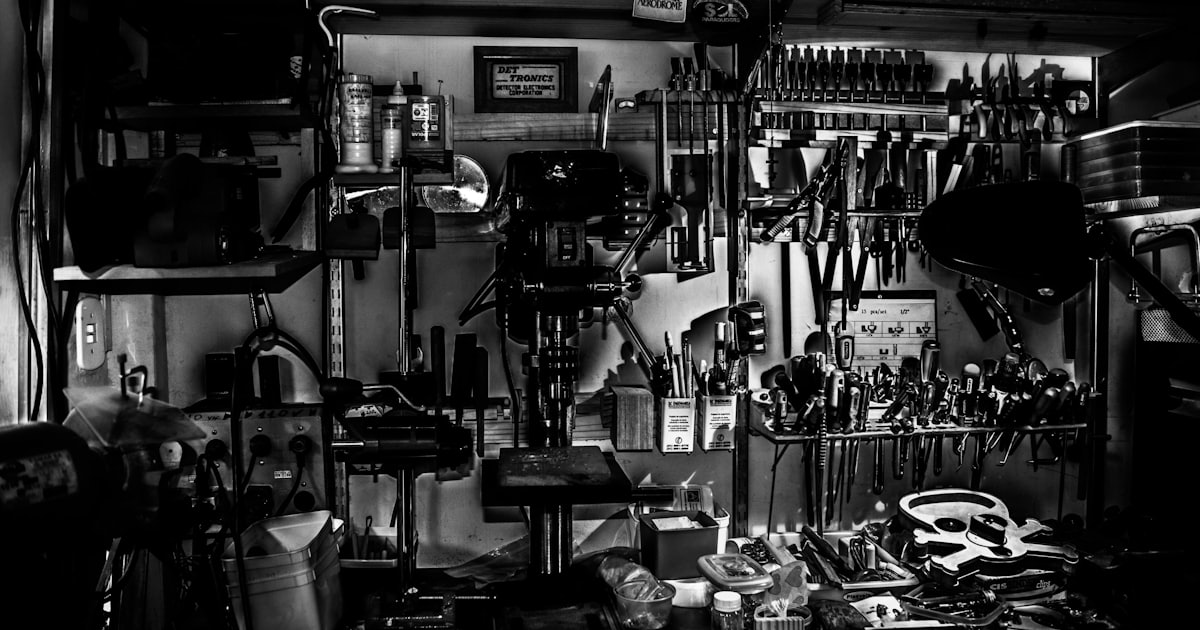 grayscale photography of metal tools