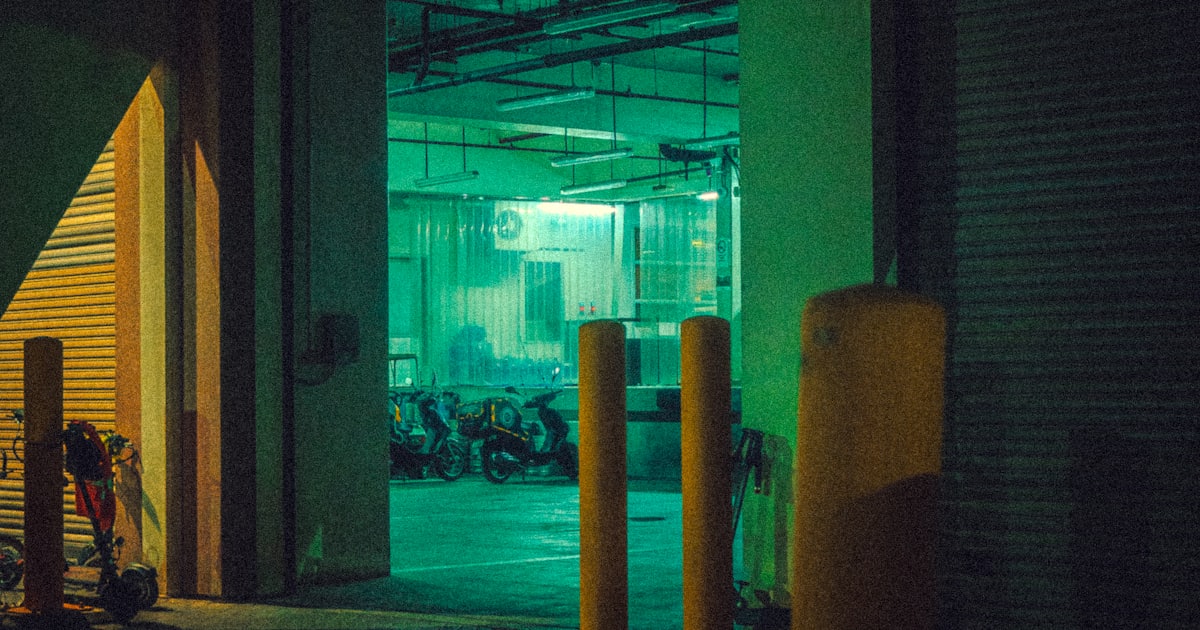 a parking garage at night with the lights on