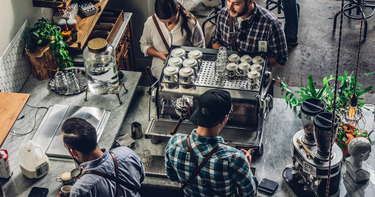man buying coffee on counter
