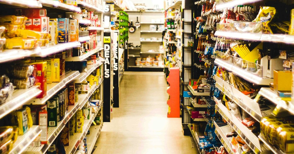 a grocery store aisle filled with lots of food