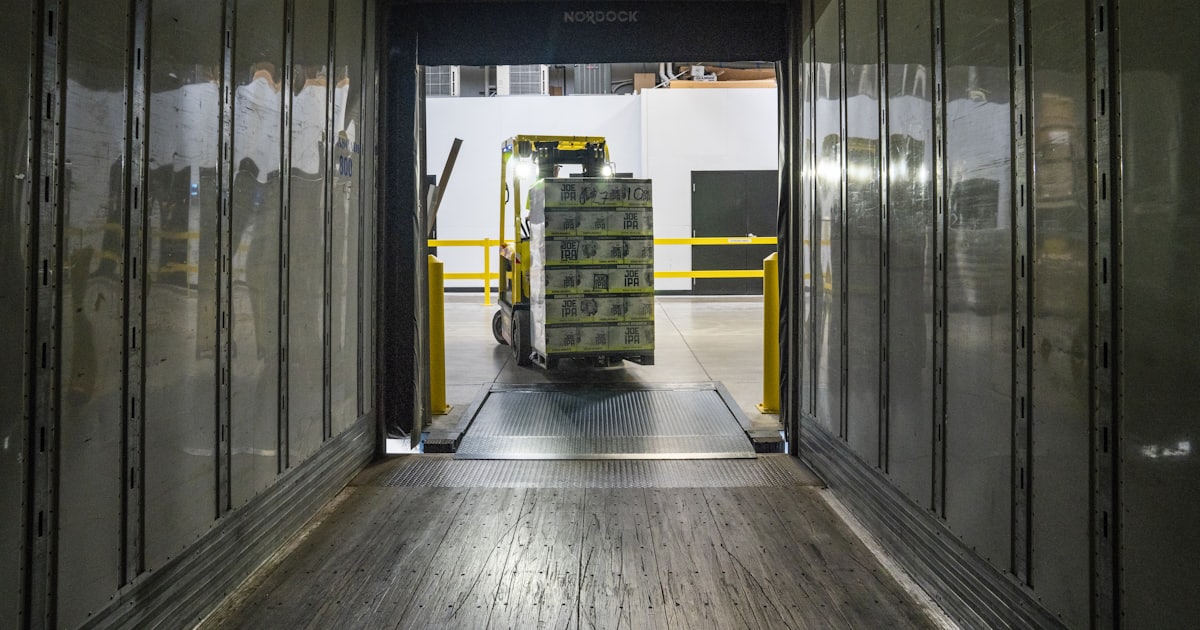 yellow and black forklift during daytime