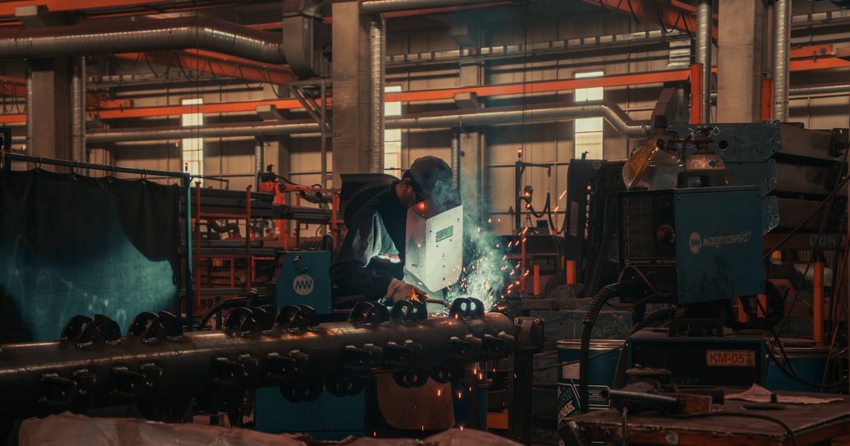 A man working on a machine in a factory