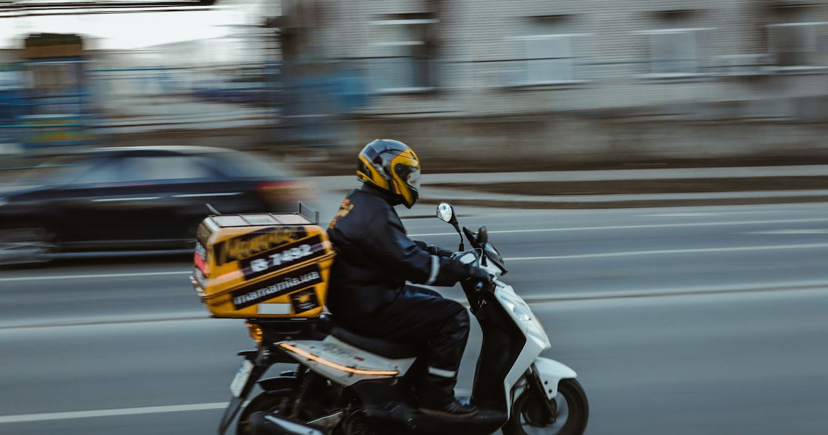 man in black jacket riding motorcycle