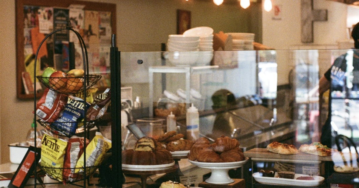 a counter in a restaurant filled with lots of food