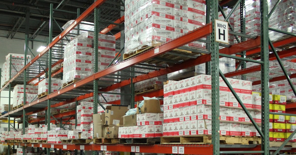 white and red cardboard boxes on shelf