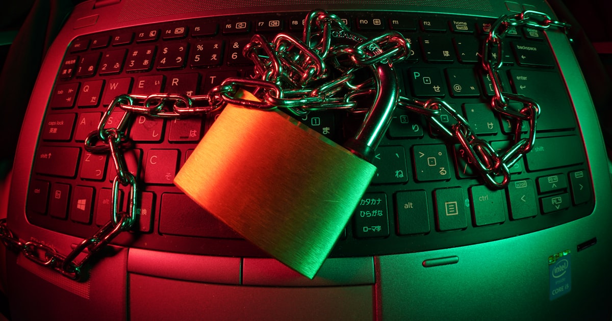 Brown padlock on black computer keyboard
