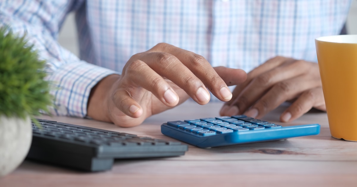 Using a calculator at a desk