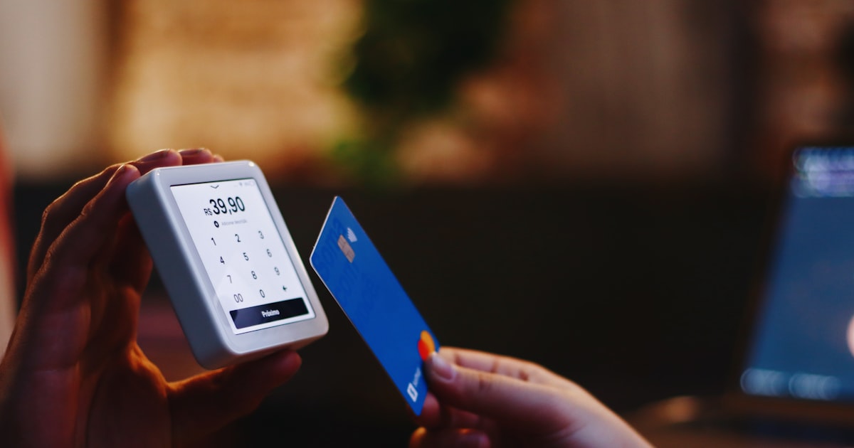 Holding a card and a phone