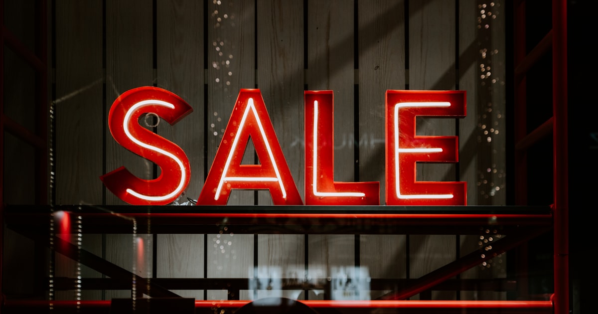 A red and white sale sign