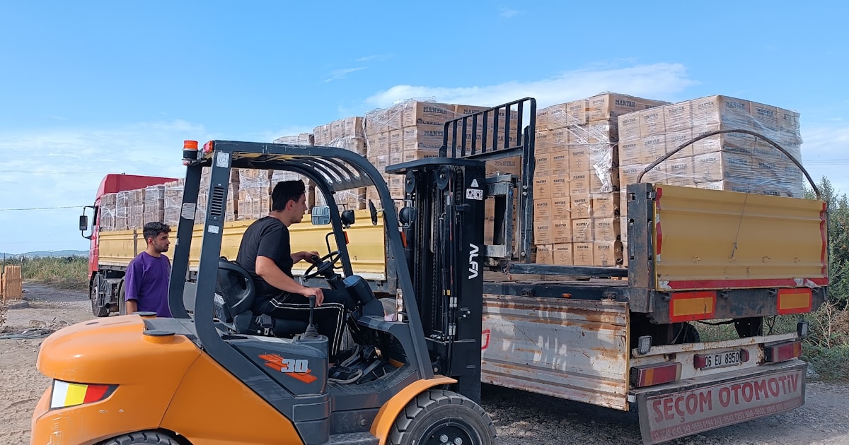 A forklift loading a truck