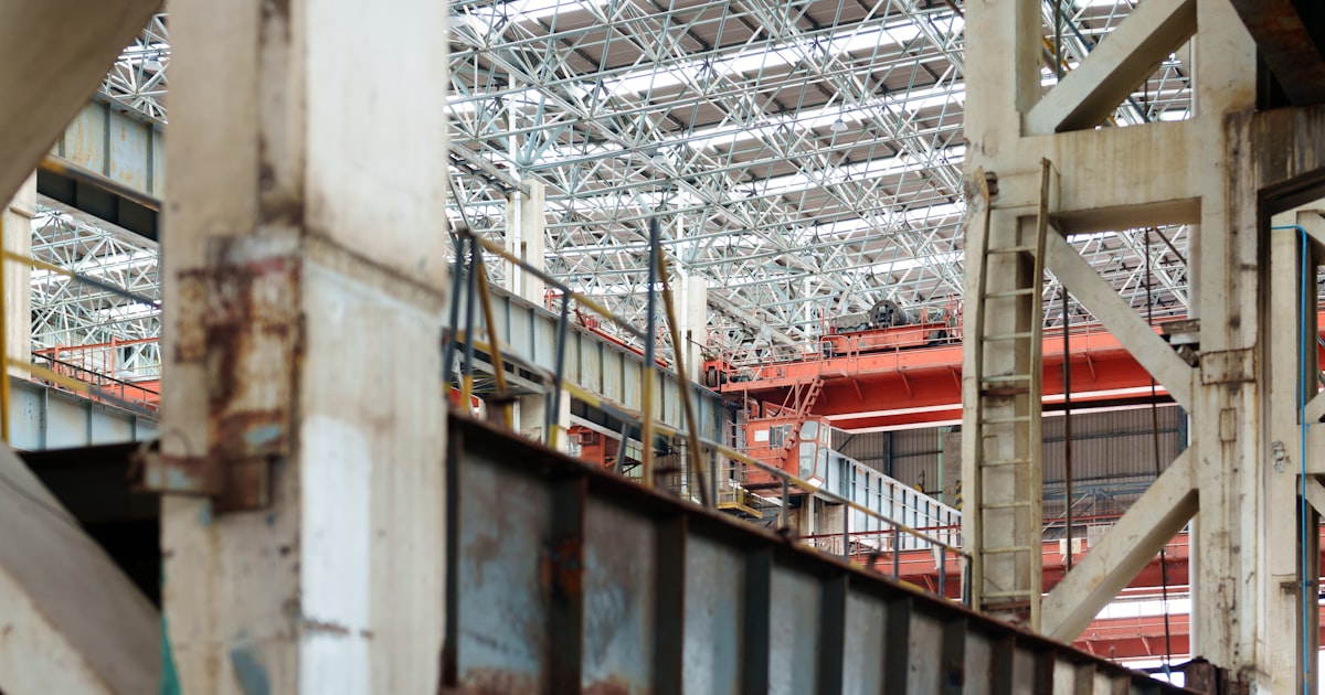 An industrial interior with a crane