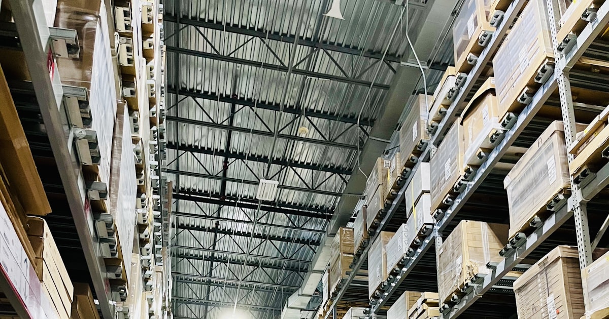 Tall warehouse shelves of boxes