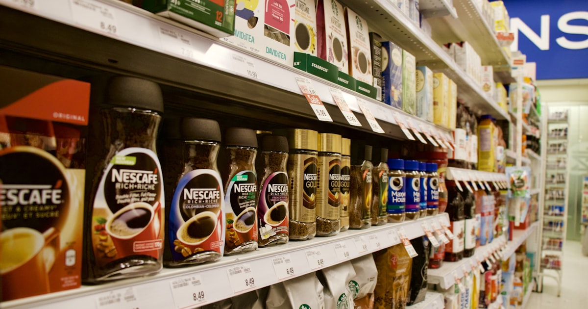 A bottle on a white retail shelf