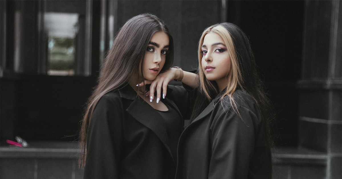 Two young women standing together