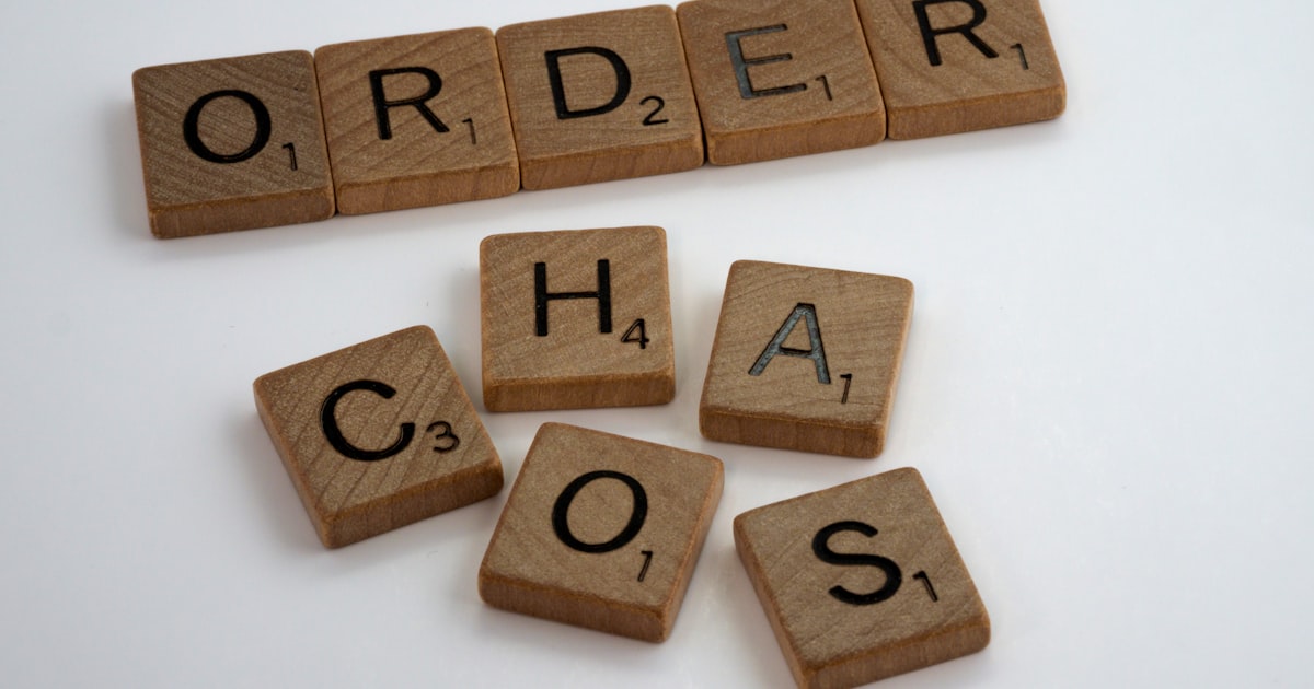Brown wooden letter blocks on white surface