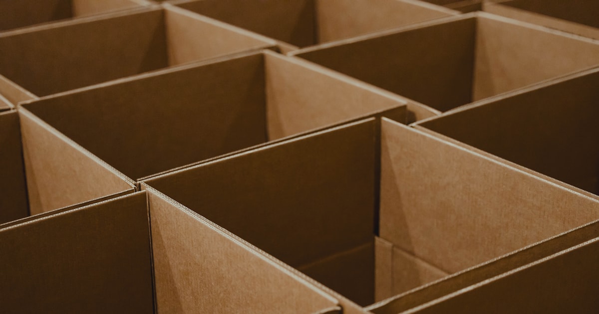 A lot of brown boxes that are open
