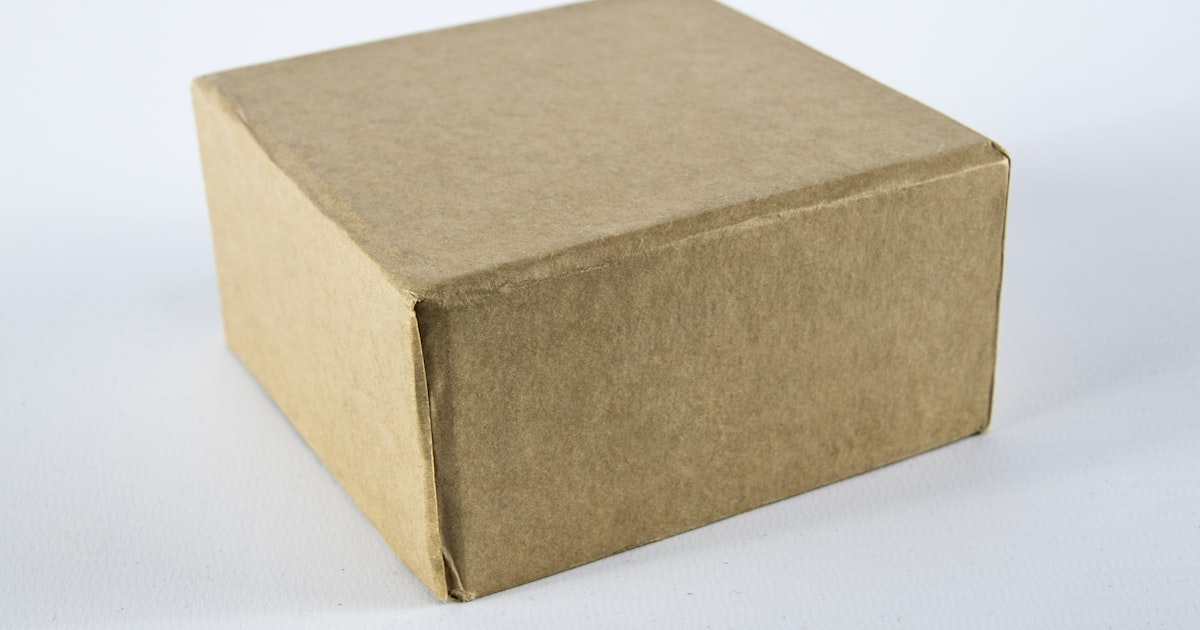 Brown cardboard box on white surface