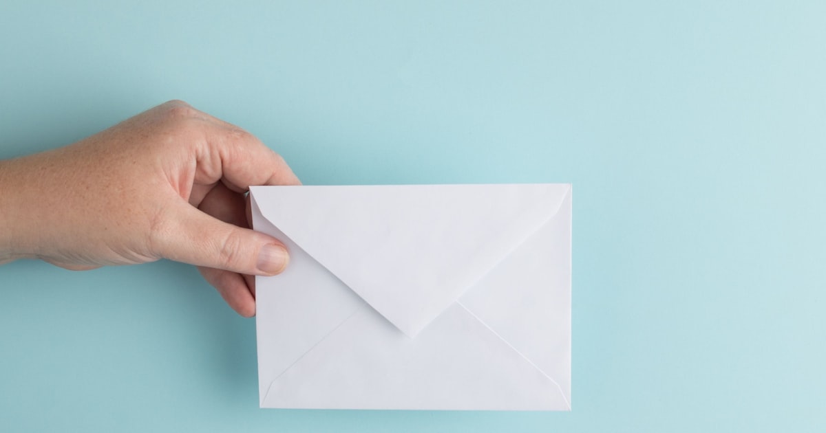 Holding an envelope