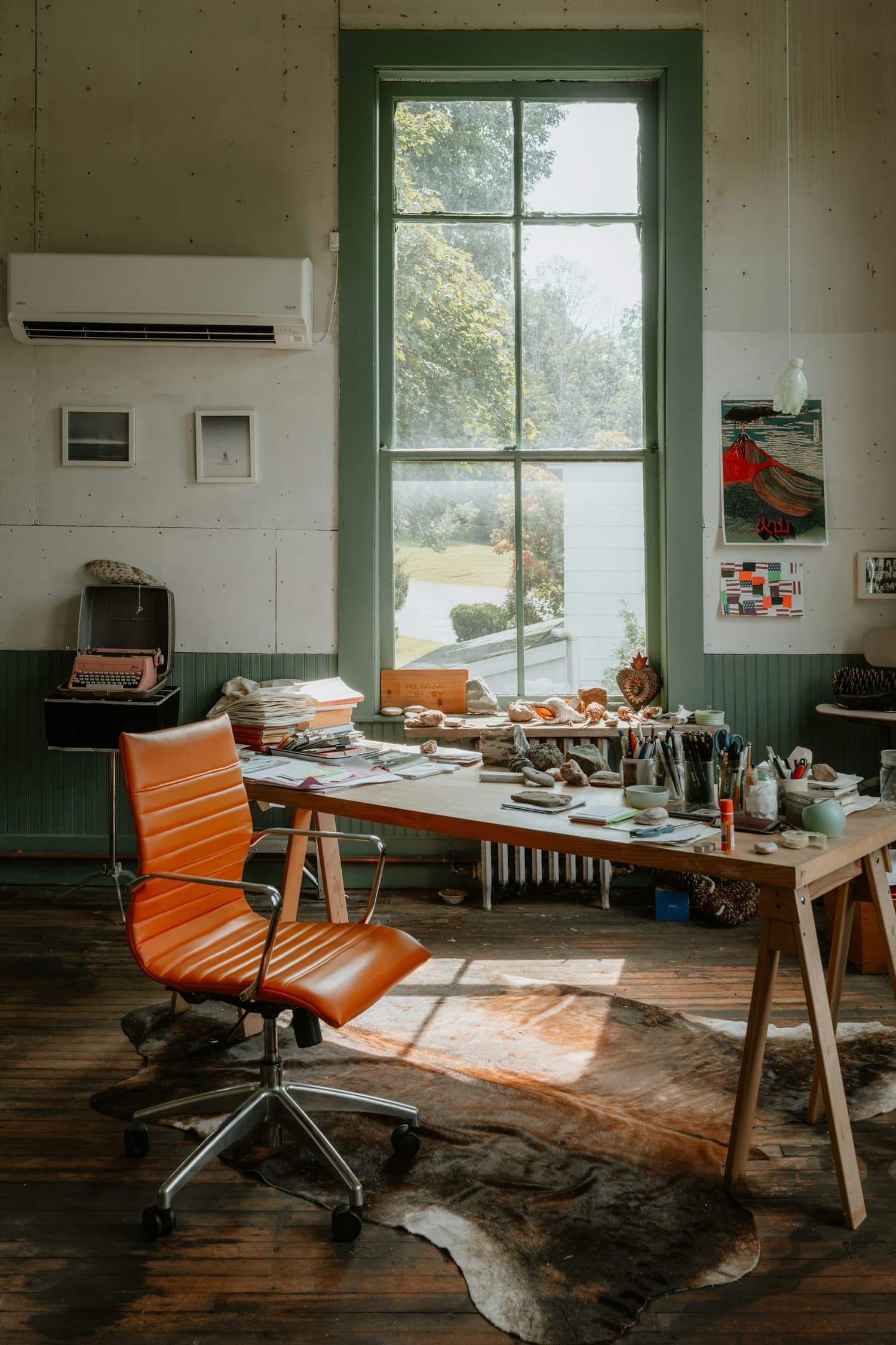 A quiet corner of the studio, late afternoon light through the window.