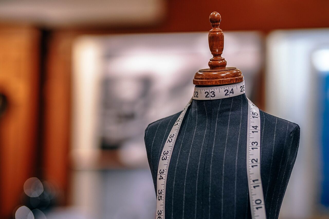 A dress form standing in a corner of the design studio