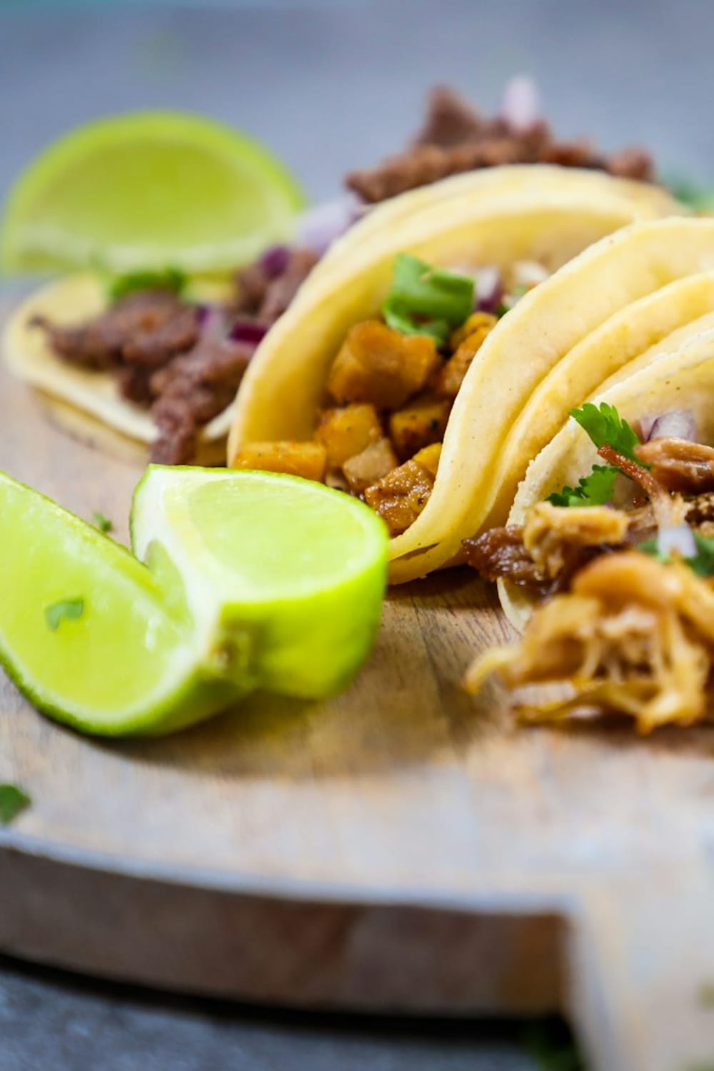 Brisket tacos on flour tortillas with chipotle crema and pickled onion