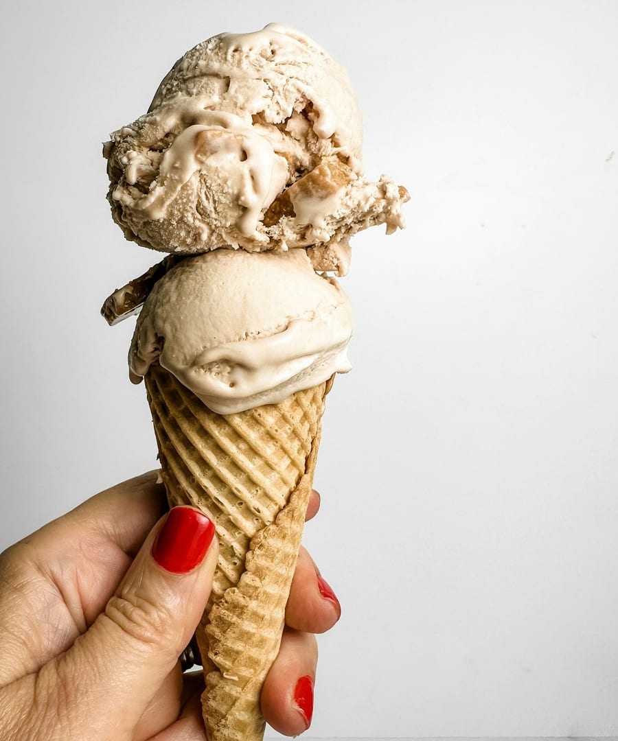 A waffle cone with scoops of small-batch gelato