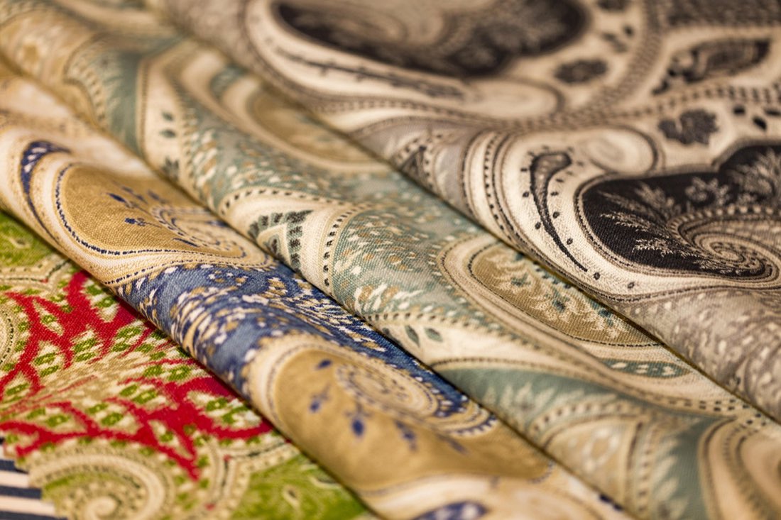 A fan of patterned fabric swatches used to select upholstery and drapery materials