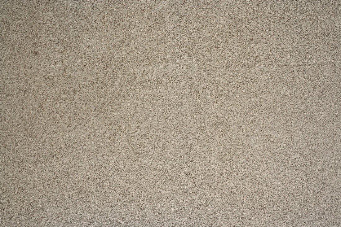 Close-up of a sand-finish stucco wall