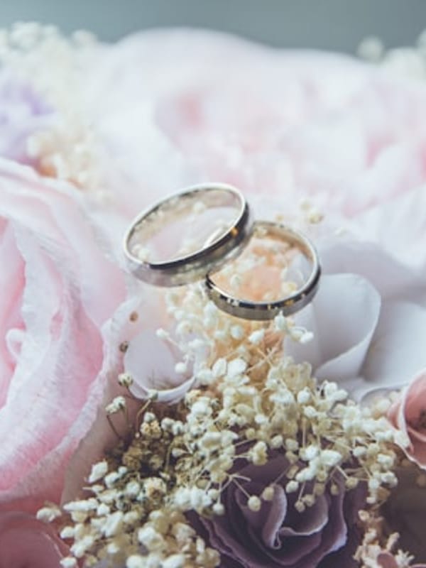 Bride with soft dewy makeup, champagne eye shadow, and rosy nude lips, garden ceremony