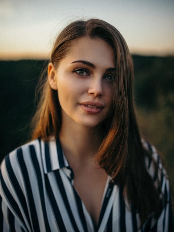 Beauty editorial close-up showing luminous glowing skin makeup for luxury skincare campaign
