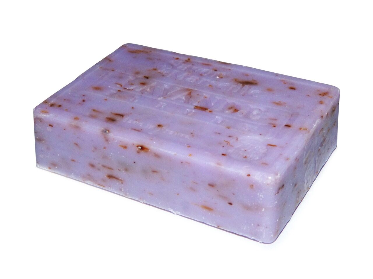 A lavender soap bar with moulded lettering and flecks of dried flower, on white