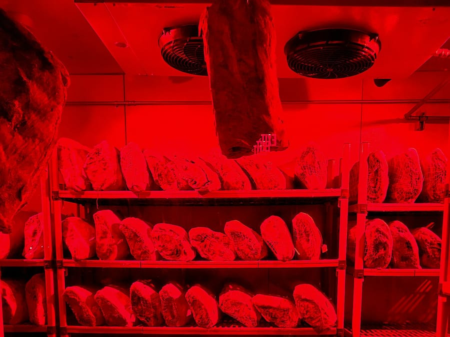 Dry-aging chamber lined with Himalayan salt with cuts on hooks