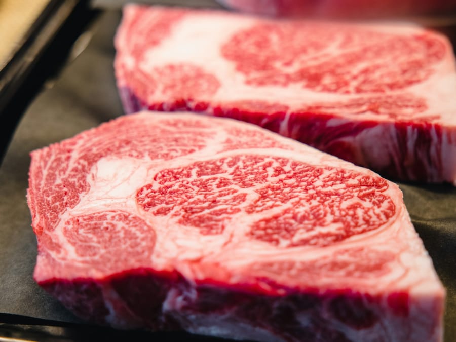 A5 Wagyu strip presented on a Himalayan salt block at tableside