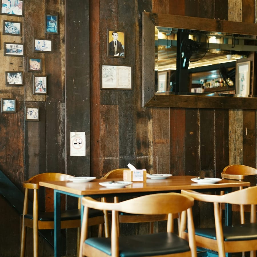 Interior of Verdant Table dining room — warm lighting, reclaimed wood