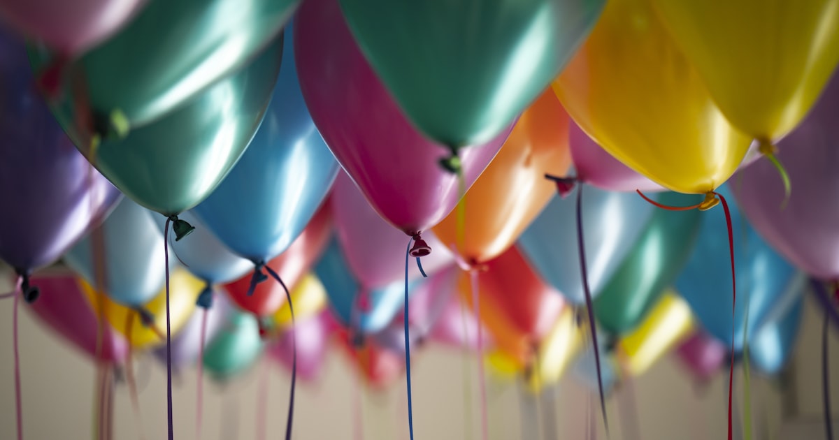 Selective focus photography of assorted-color balloons