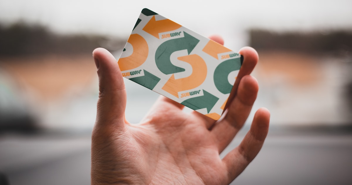 Person holding a discount card