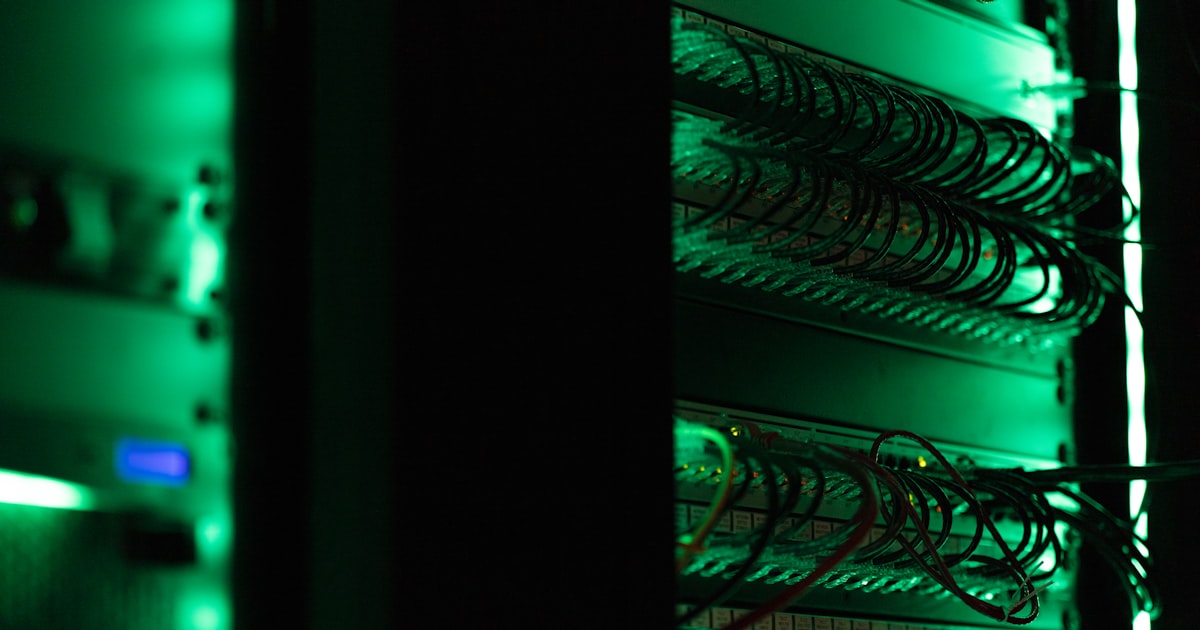 A rack of electronic equipment in a dark room