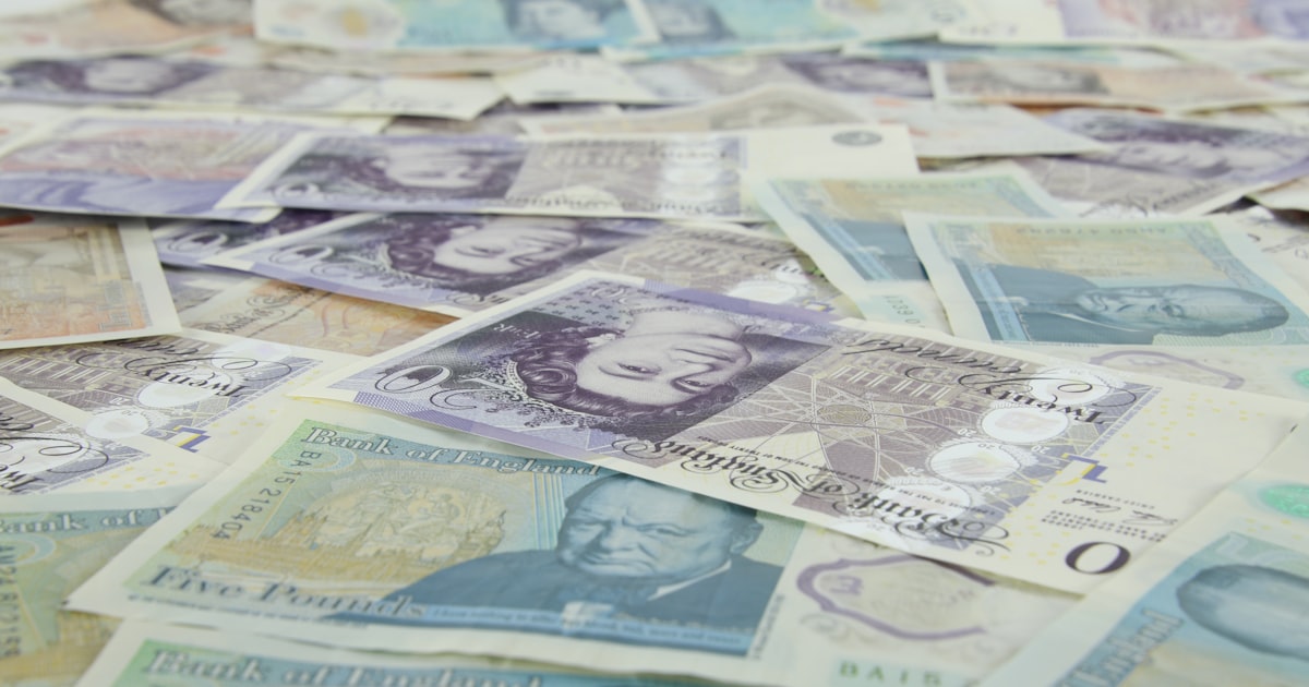 Banknotes on yellow and white textile