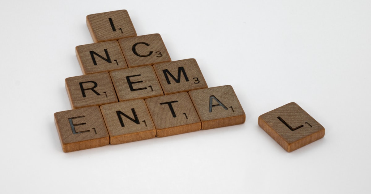 A scrabbled wooden block with the words incremential and rental