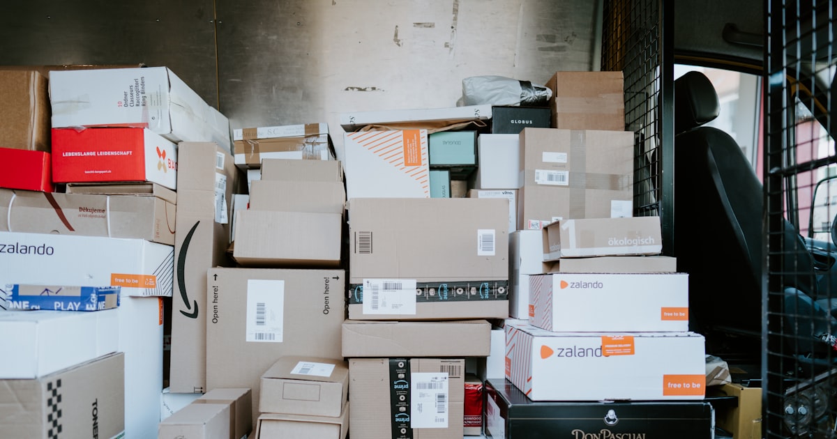 Brown cardboard boxes on a black plastic crate