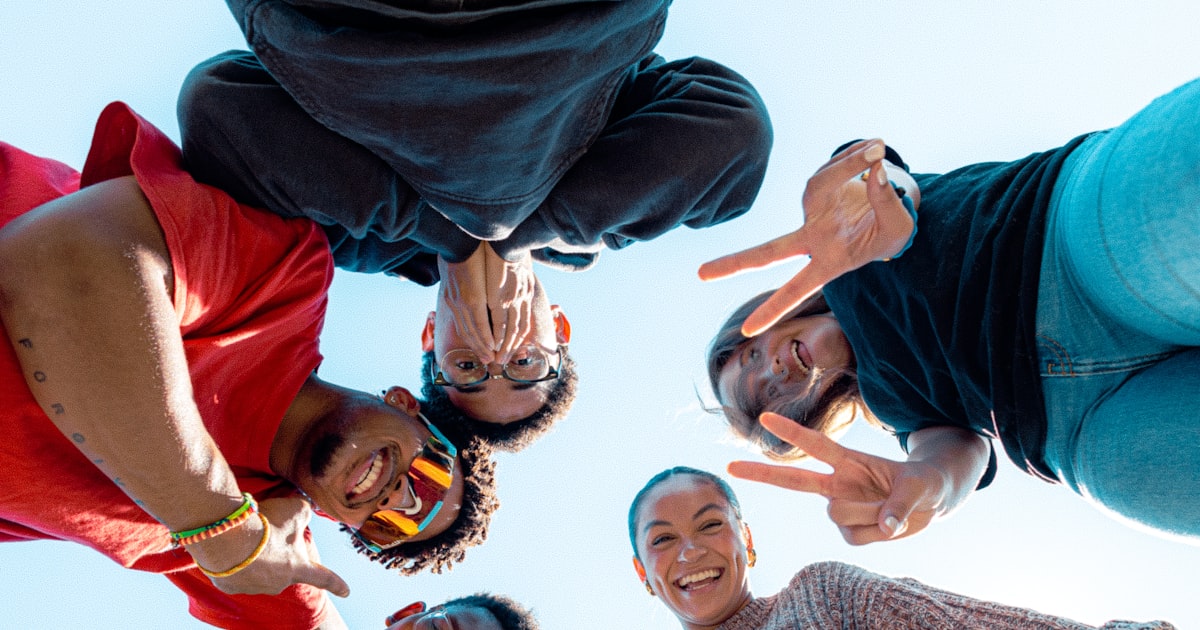 A group of people standing in a circle