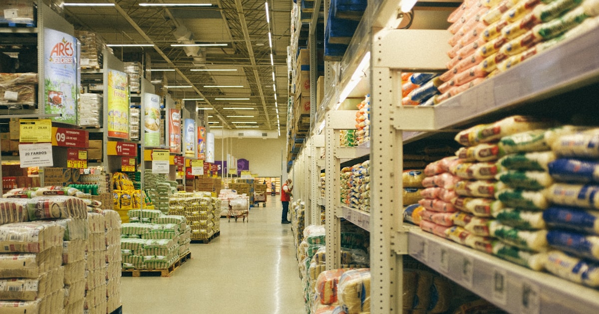 A white metal shelf with food packs