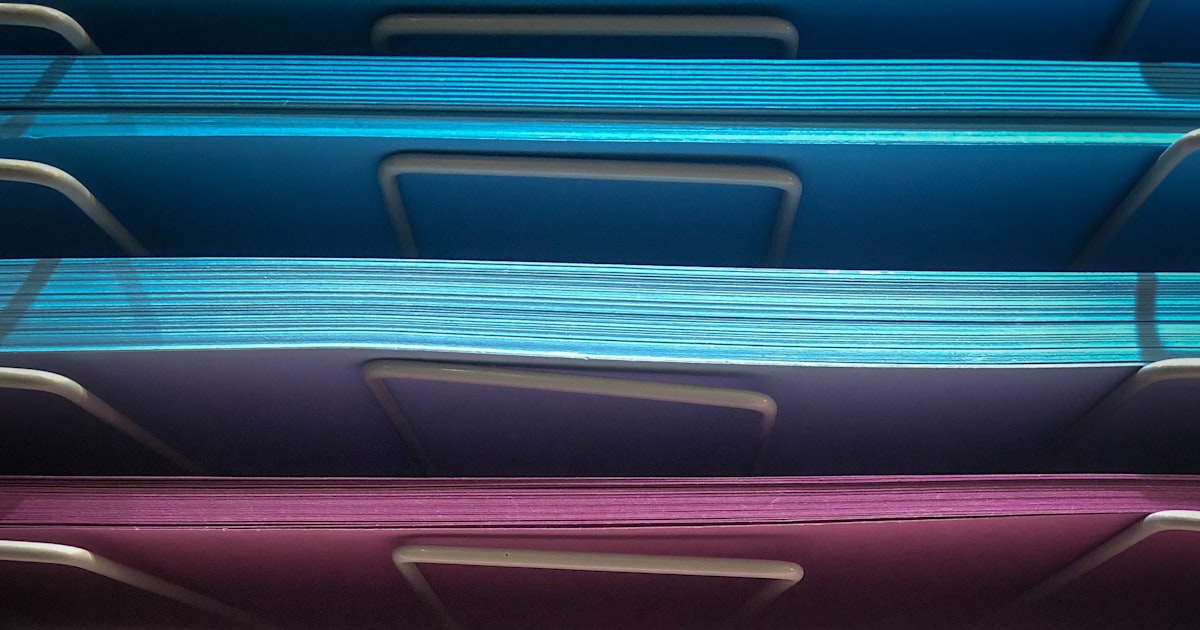 A pile of assorted color papers